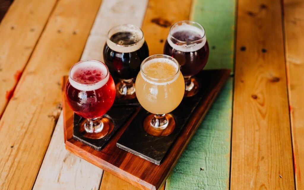 a flight of beers at the ile sauvage brewery in victoria, bc